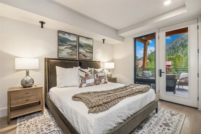 a bedroom with a large bed and a window