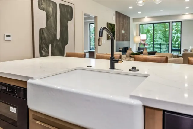 a bathroom with a sink and a large mirror