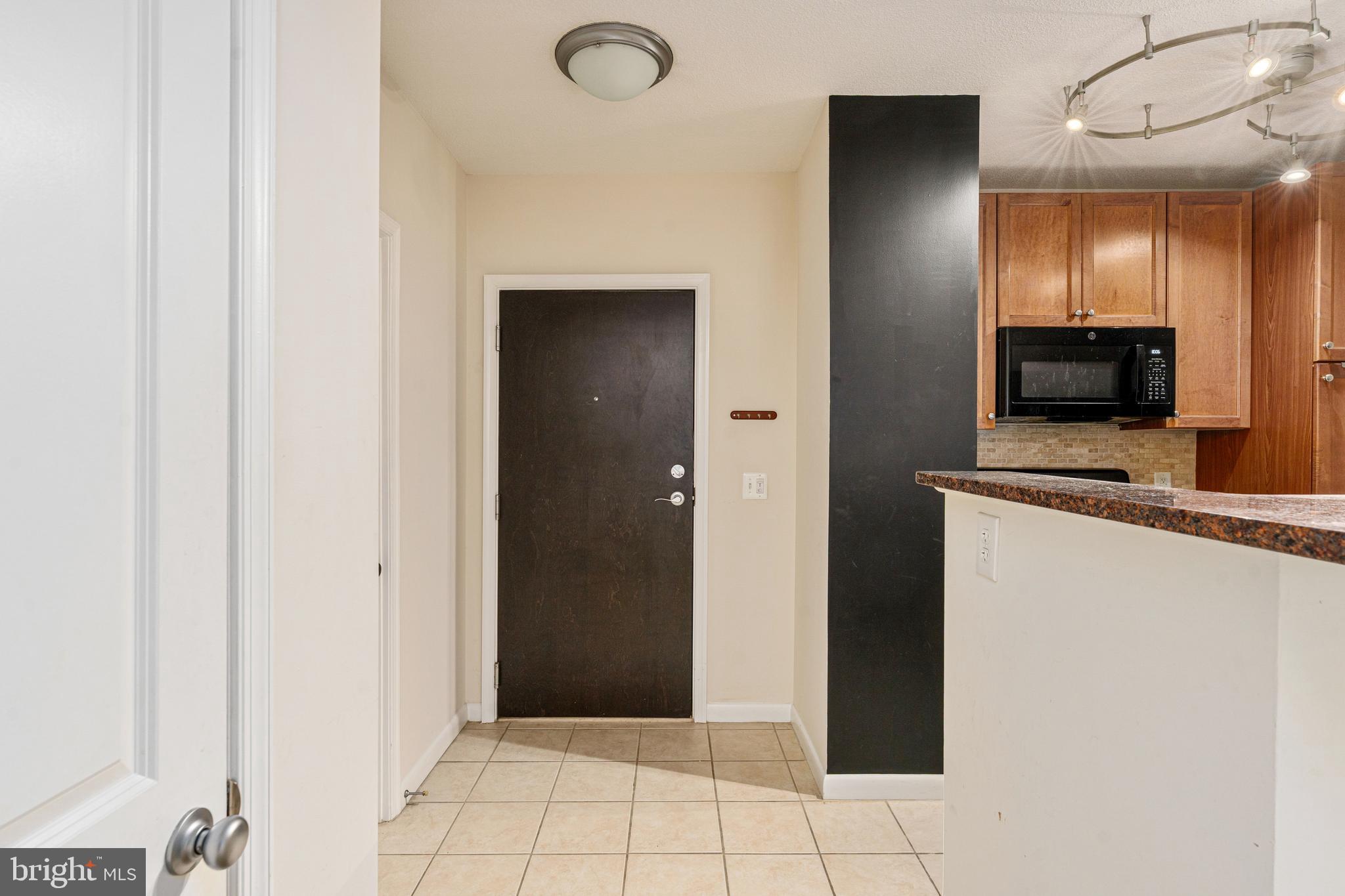 851 North Glebe Road, Unit 1407 Arlington, VA 22203 - Photo 12 of 51 a view of a kitchen from the hallway