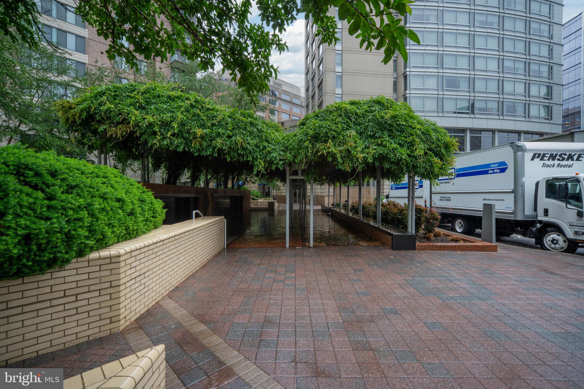 851 North Glebe Road, Unit 1407 Arlington, VA 22203 - Photo 2 of 51 a view of a cars park in front of a building