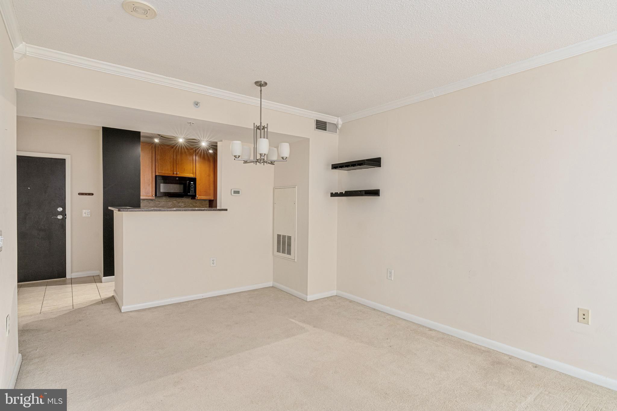 851 North Glebe Road, Unit 1407 Arlington, VA 22203 - Photo 26 of 51 a view of a kitchen with a sink and a refrigerator