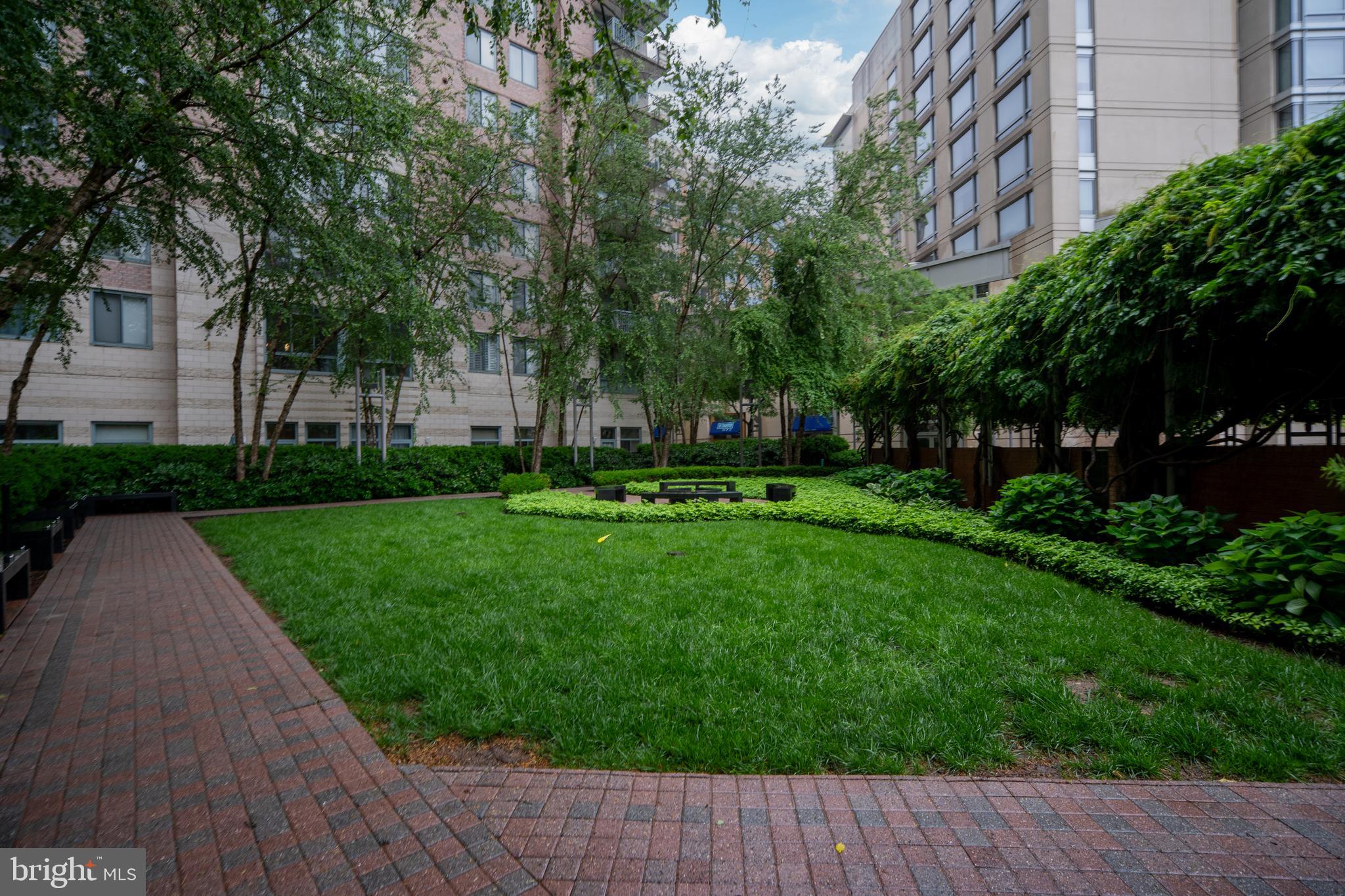 851 North Glebe Road, Unit 1407 Arlington, VA 22203 - Photo 3 of 51 a front view of a house with a yard
