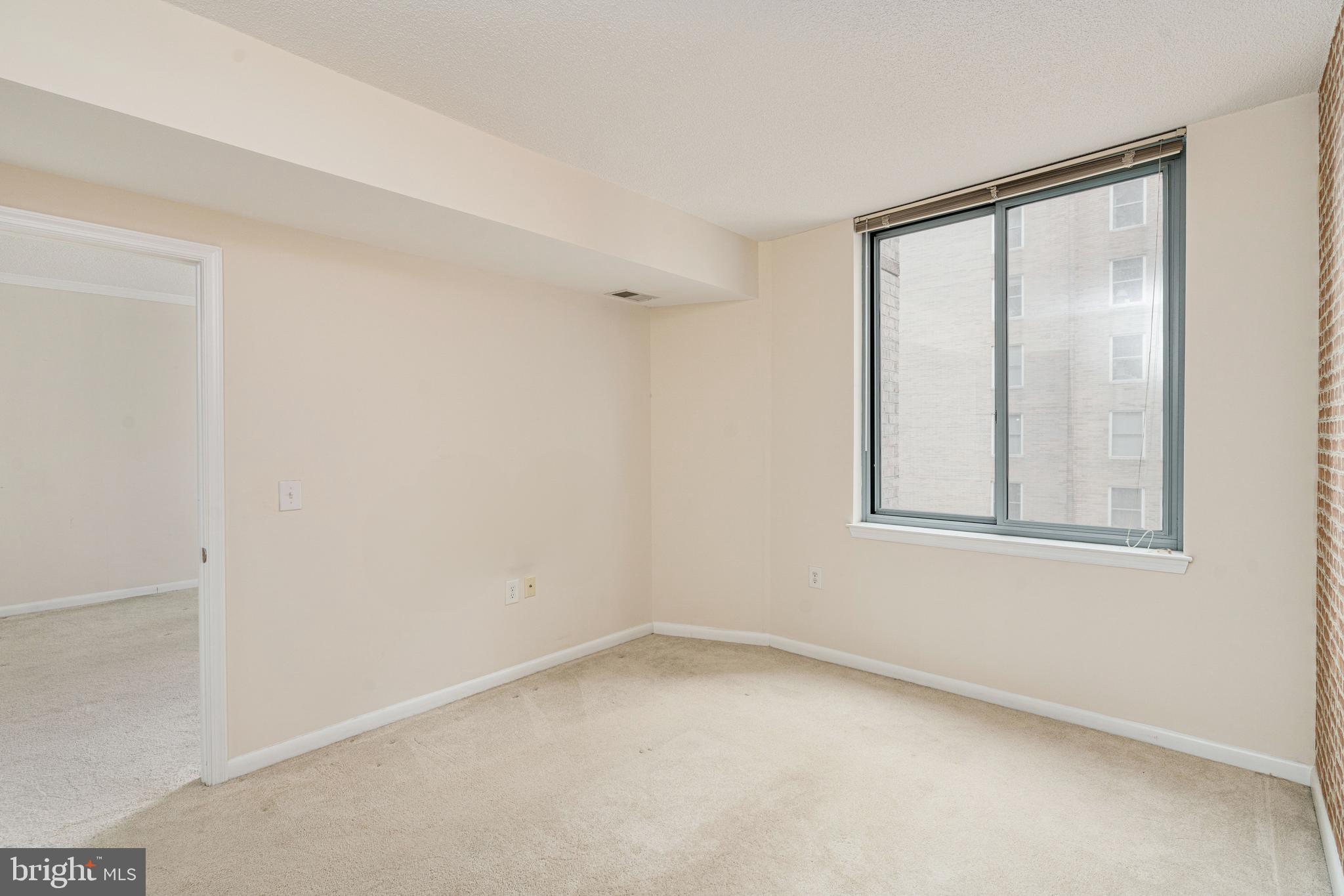 851 North Glebe Road, Unit 1407 Arlington, VA 22203 - Photo 32 of 51 an empty room with a window
