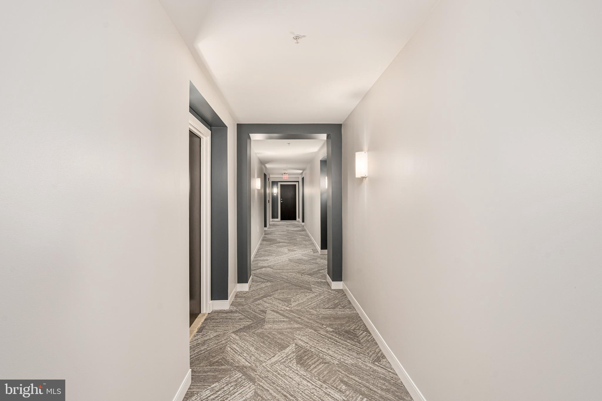 851 North Glebe Road, Unit 1407 Arlington, VA 22203 - Photo 38 of 51 a view of a hallway with a white walls