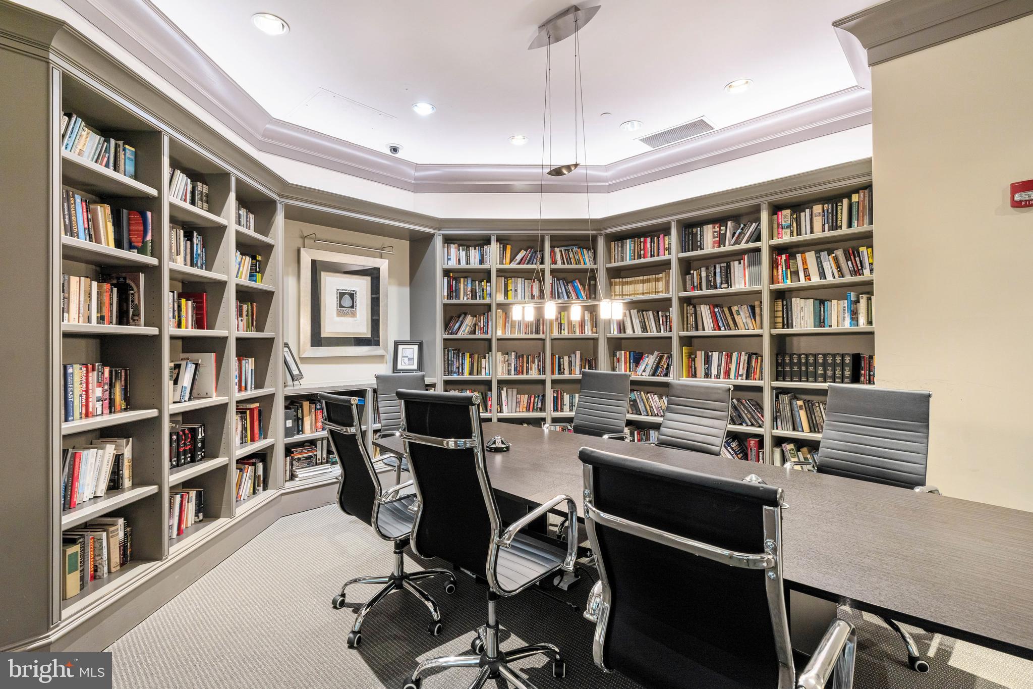 851 North Glebe Road, Unit 1407 Arlington, VA 22203 - Photo 6 of 51 a view of a workspace with furniture and a bookshelf