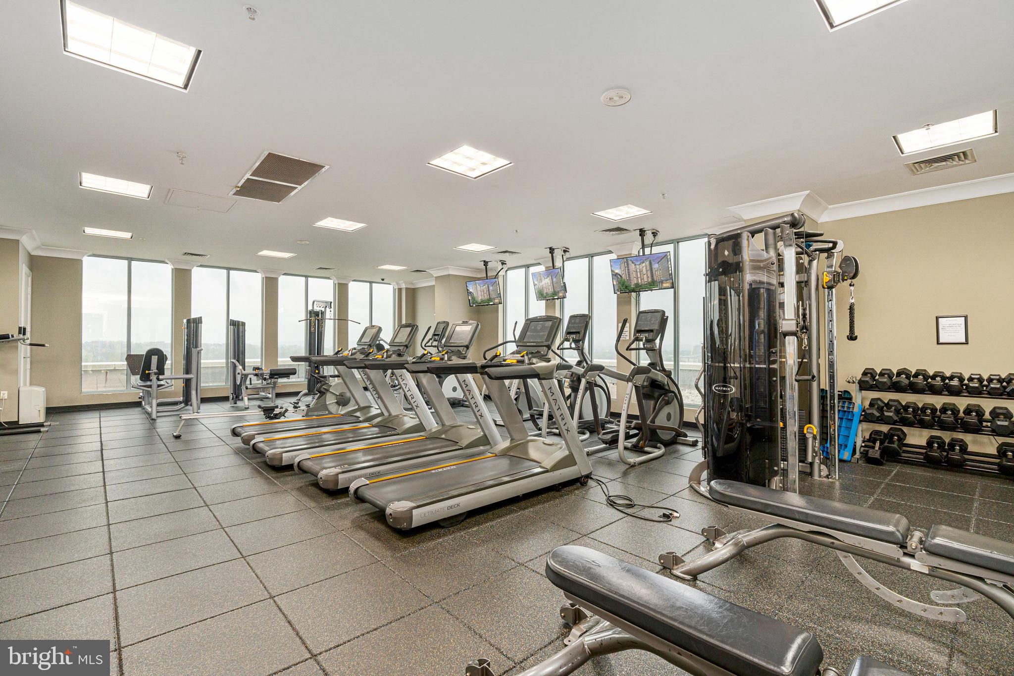 851 North Glebe Road, Unit 1407 Arlington, VA 22203 - Photo 8 of 51 a living room with lots of furniture and air hockey table