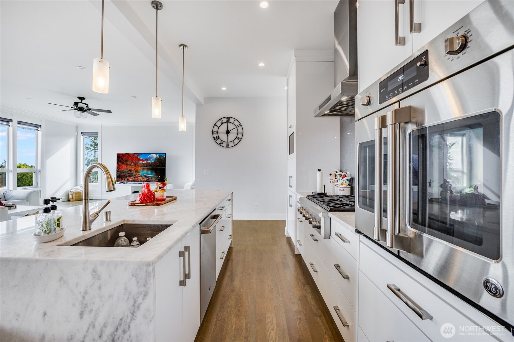 17323 Military Road South SeaTac, WA 98188 - Photo 11 of 40 a kitchen with stainless steel appliances a stove a sink and a refrigerator
