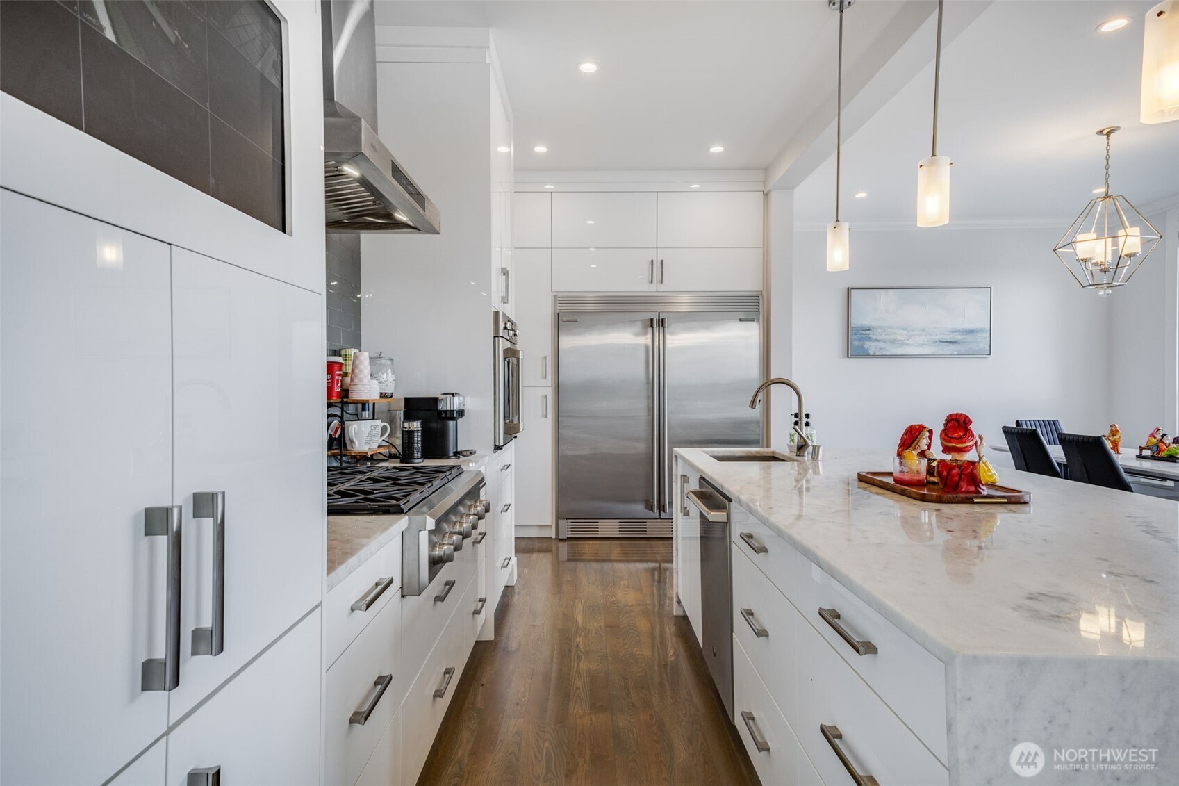 17323 Military Road South SeaTac, WA 98188 - Photo 12 of 40 a kitchen with cabinets and stainless steel appliances