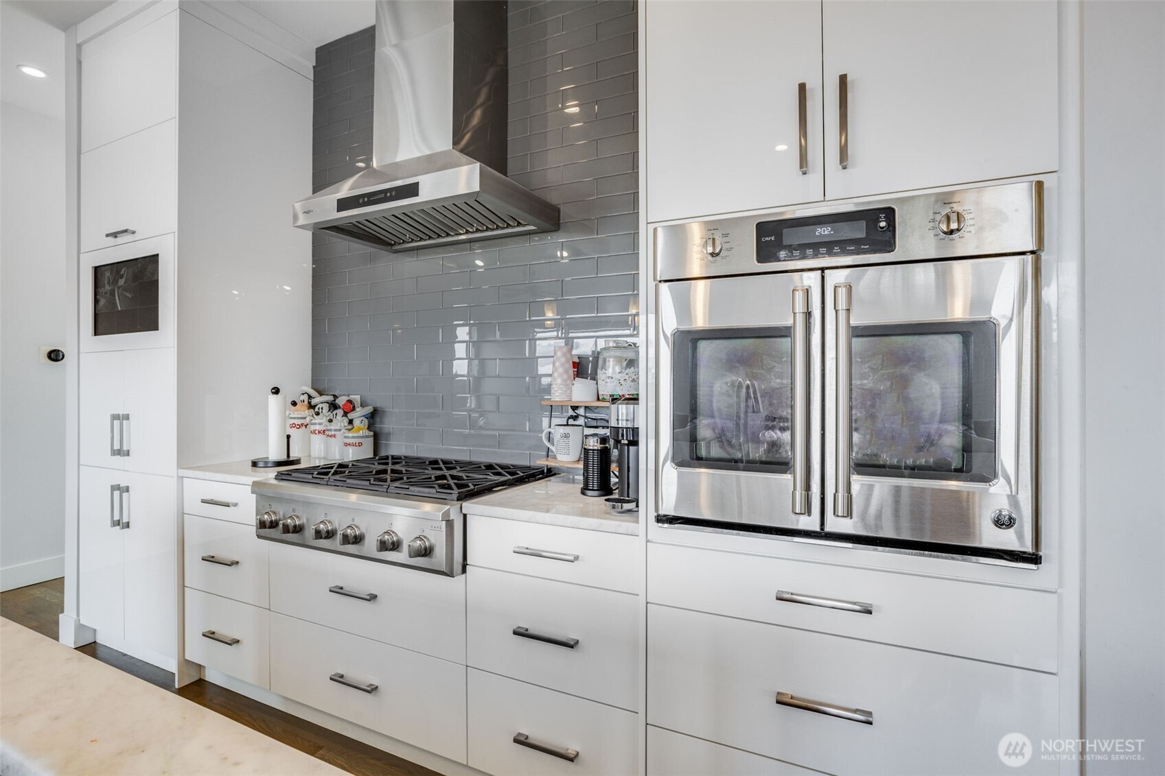 17323 Military Road South SeaTac, WA 98188 - Photo 15 of 40 a kitchen with stainless steel appliances granite countertop a stove and a refrigerator