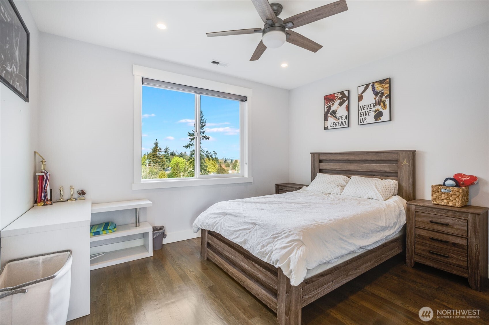 17323 Military Road South SeaTac, WA 98188 - Photo 22 of 40 a bedroom with a bed and a chandelier