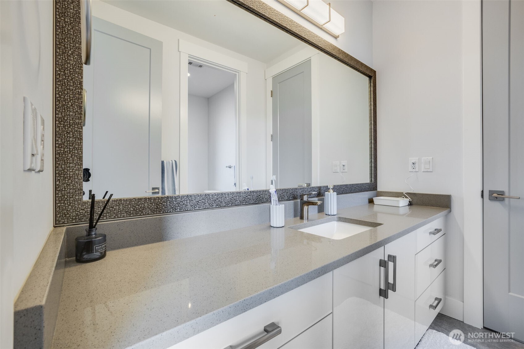 17323 Military Road South SeaTac, WA 98188 - Photo 26 of 40 a bathroom with a granite countertop sink and a mirror