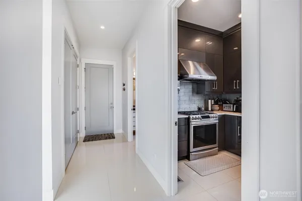 a kitchen with stainless steel appliances granite countertop a stove and a refrigerator