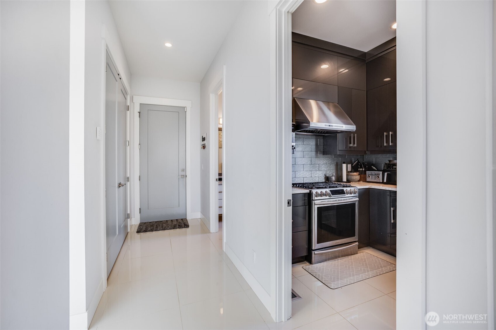 17323 Military Road South SeaTac, WA 98188 - Photo 29 of 40 a kitchen with stainless steel appliances granite countertop a stove and a refrigerator