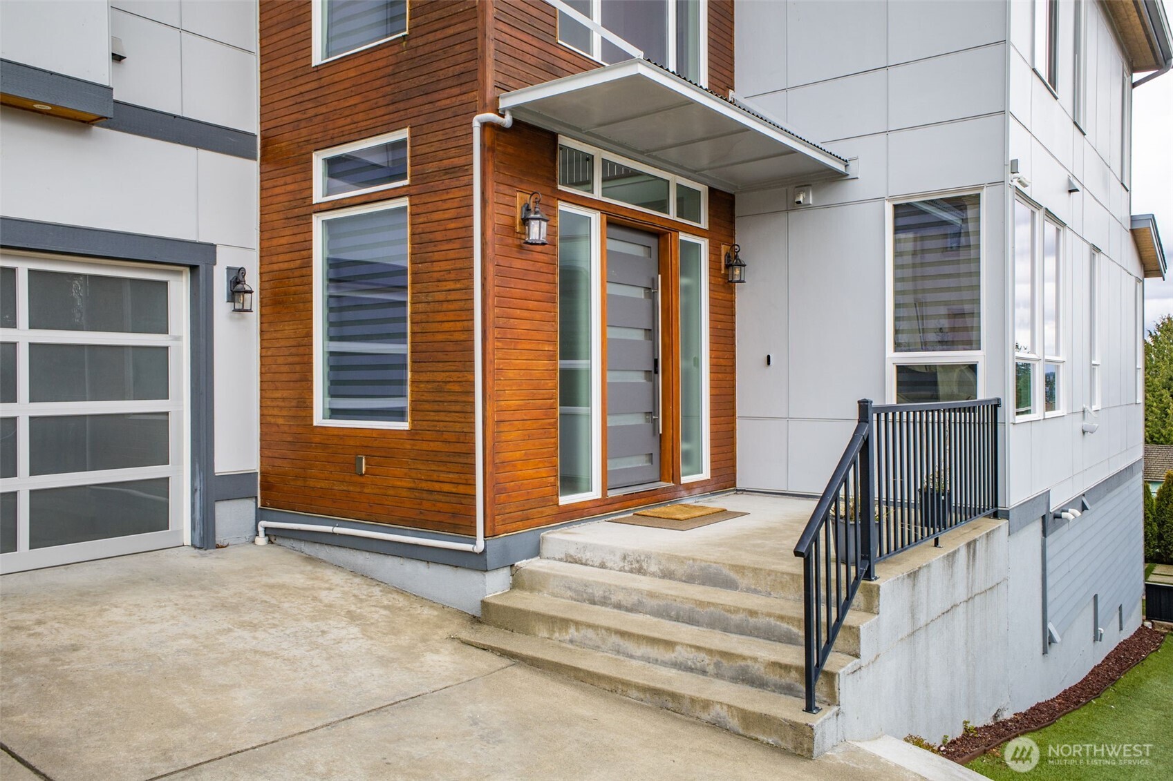 17323 Military Road South SeaTac, WA 98188 - Photo 3 of 40 a view of wooden house with a large windows