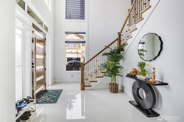 a view of entryway with wooden floor and stairs