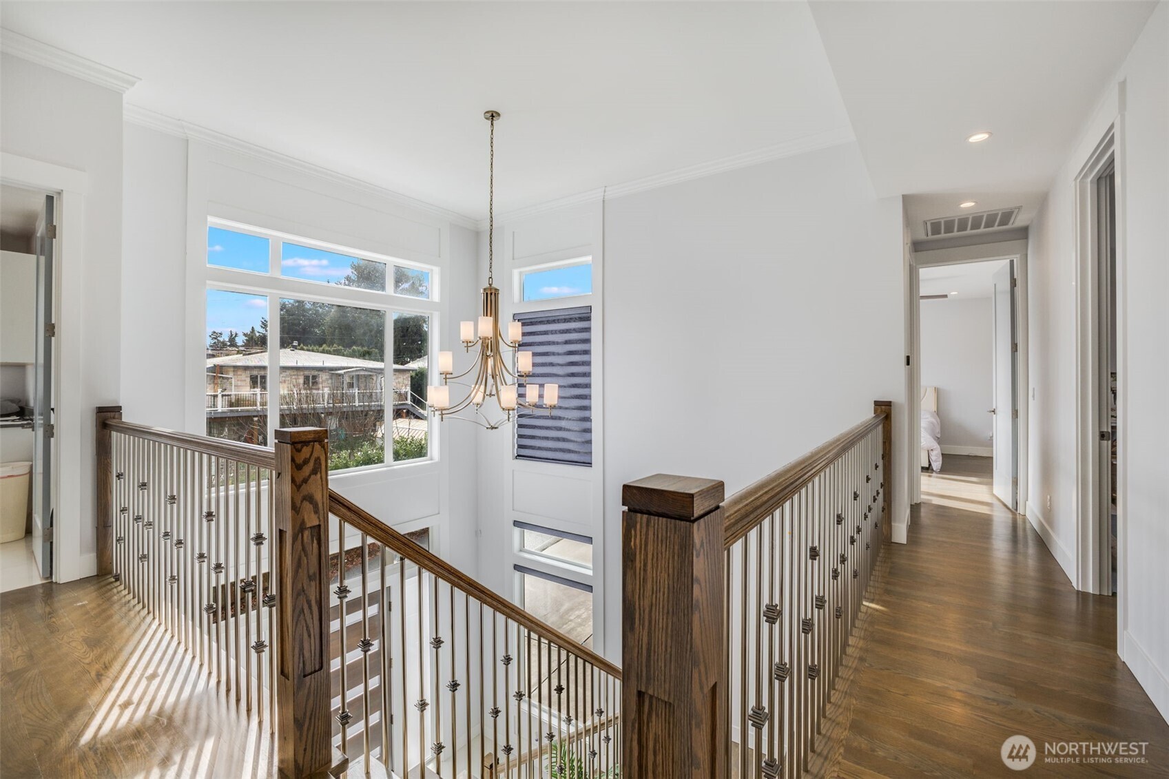 17323 Military Road South SeaTac, WA 98188 - Photo 7 of 40 a view of a hallway with wooden floor and windows