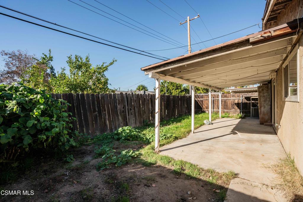 1421 Sequoia Avenue Simi Valley, CA 93063 - Photo 15 of 18 a view of a backyard with plants and wooden fence