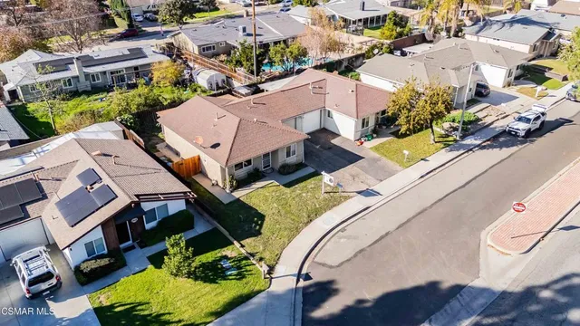 an aerial view of a house with a swimming pool