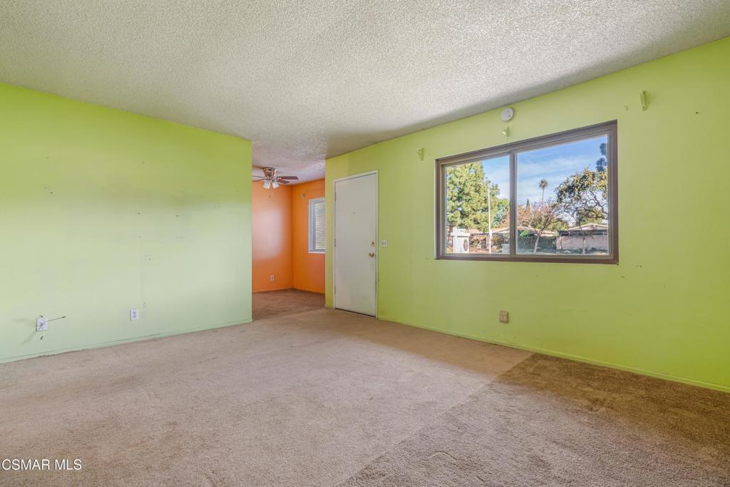 1421 Sequoia Avenue Simi Valley, CA 93063 - Photo 6 of 18 an empty room with a window and a ceiling fan
