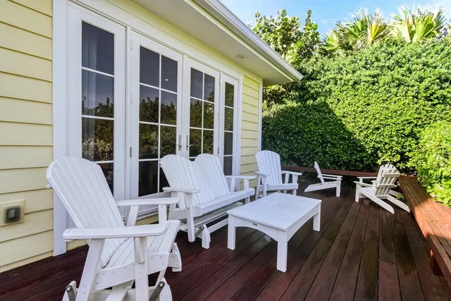 a view of a chairs and table in a patio