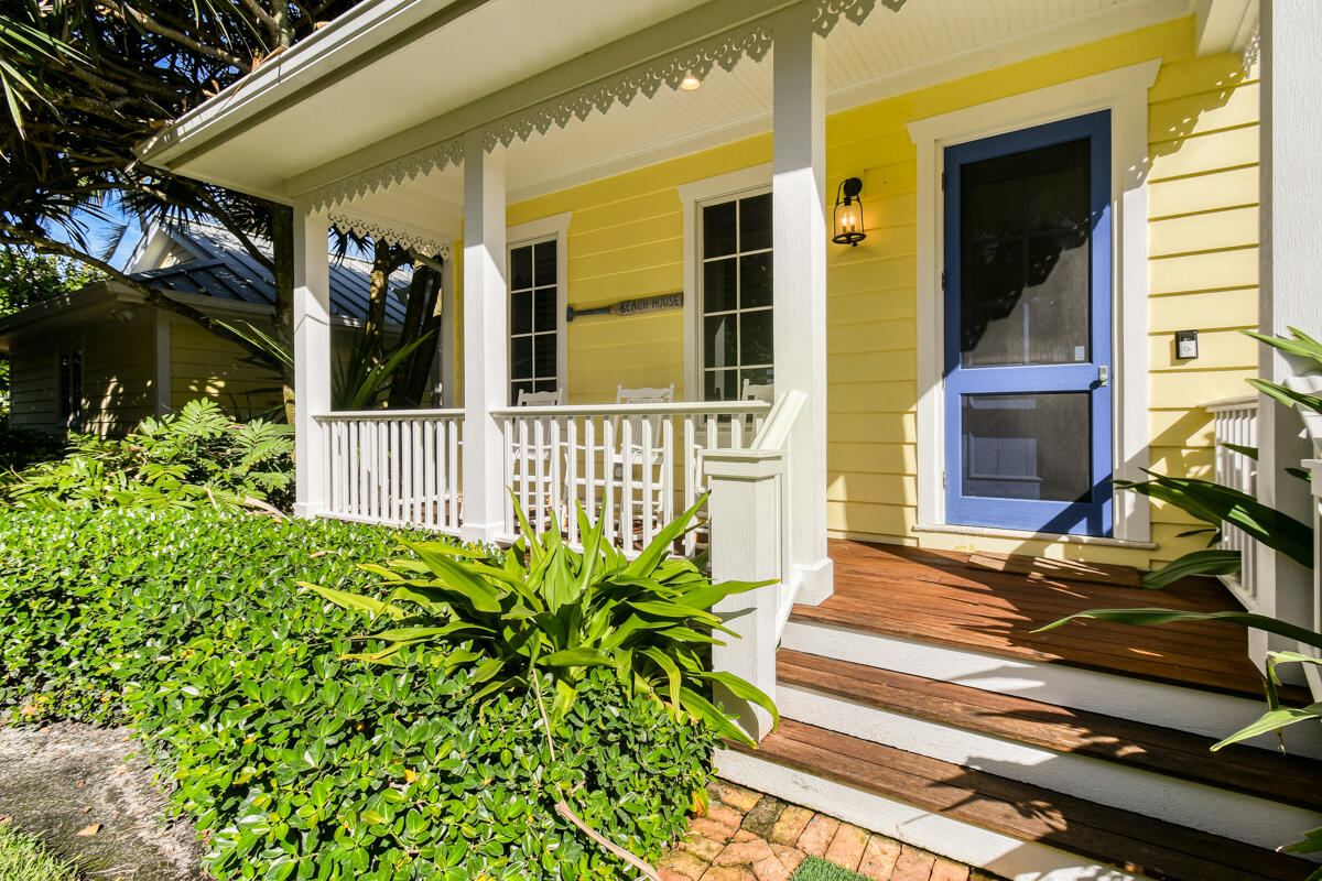 107 North Beach Road Jupiter Island, FL 33455 - Photo 16 of 49 a front view of a house with a yard