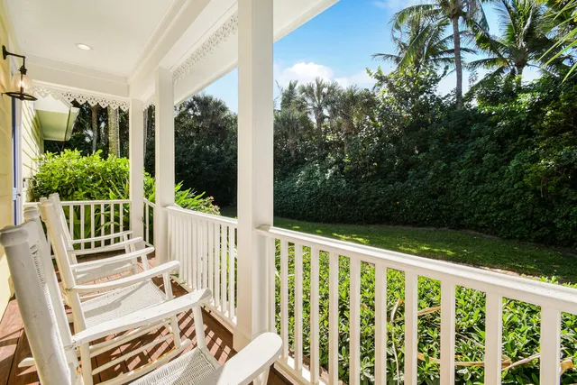 a view of a chair and table in the balcony