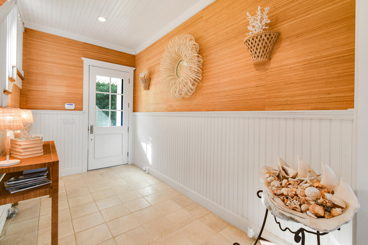 107 North Beach Road Jupiter Island, FL 33455 - Photo 19 of 49 a view of a entryway door of the house