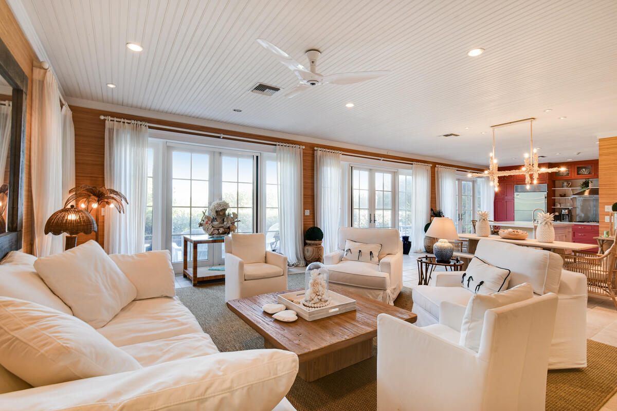 107 North Beach Road Jupiter Island, FL 33455 - Photo 20 of 49 a living room with furniture and a large window