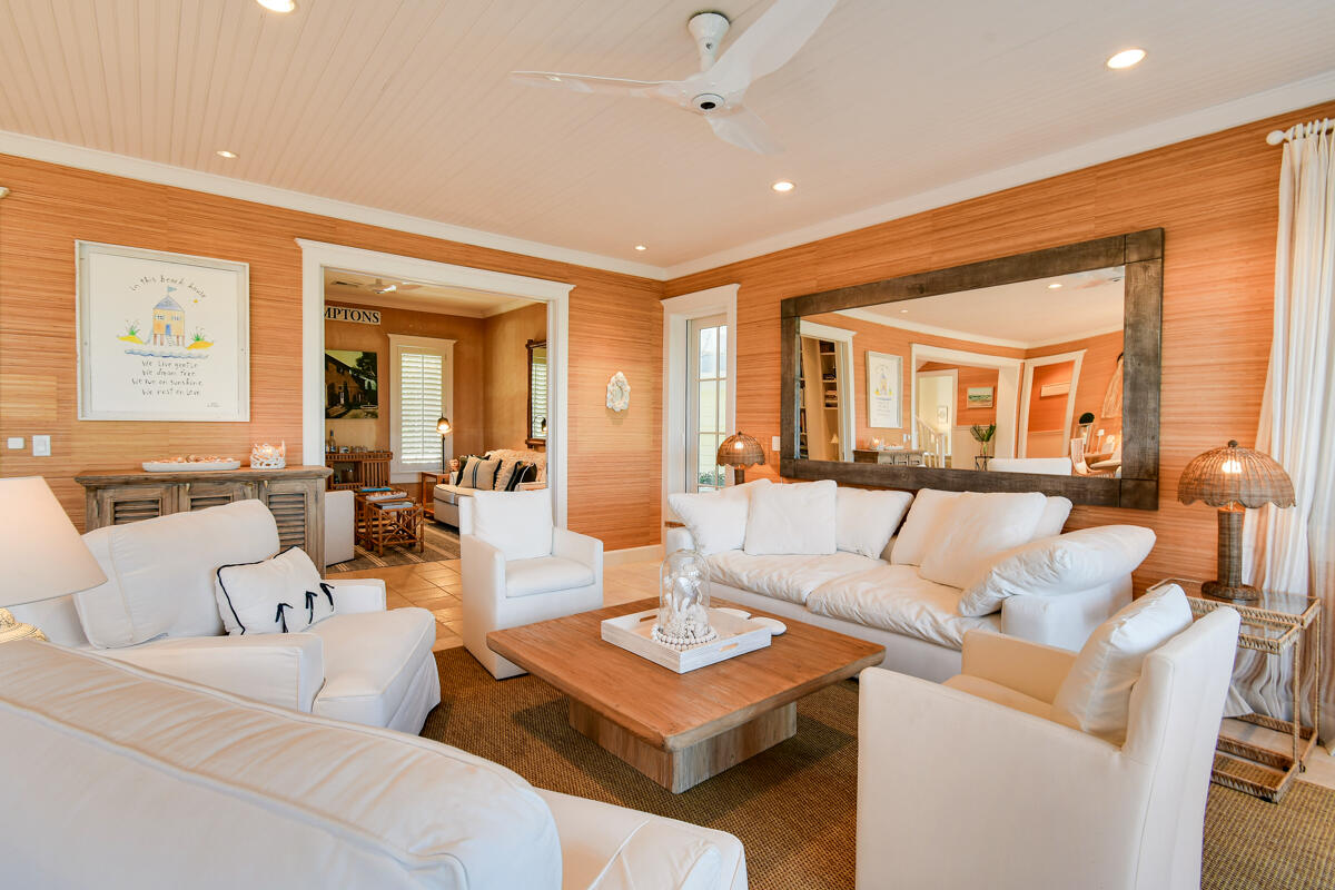 107 North Beach Road Jupiter Island, FL 33455 - Photo 21 of 49 a living room with furniture and a large window