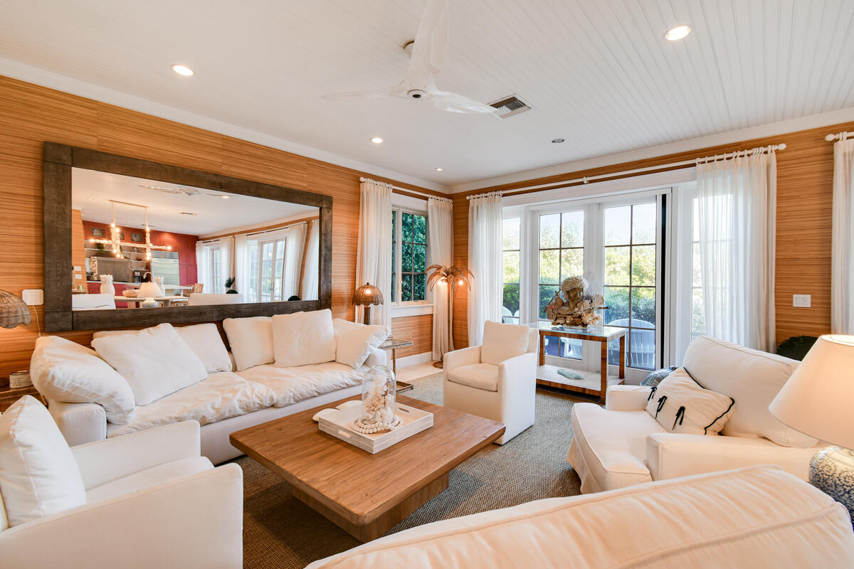 107 North Beach Road Jupiter Island, FL 33455 - Photo 22 of 49 a living room with furniture and a large window