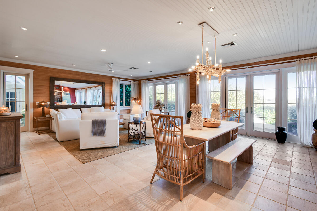 107 North Beach Road Jupiter Island, FL 33455 - Photo 23 of 49 a view of a dining room with furniture and a chandelier