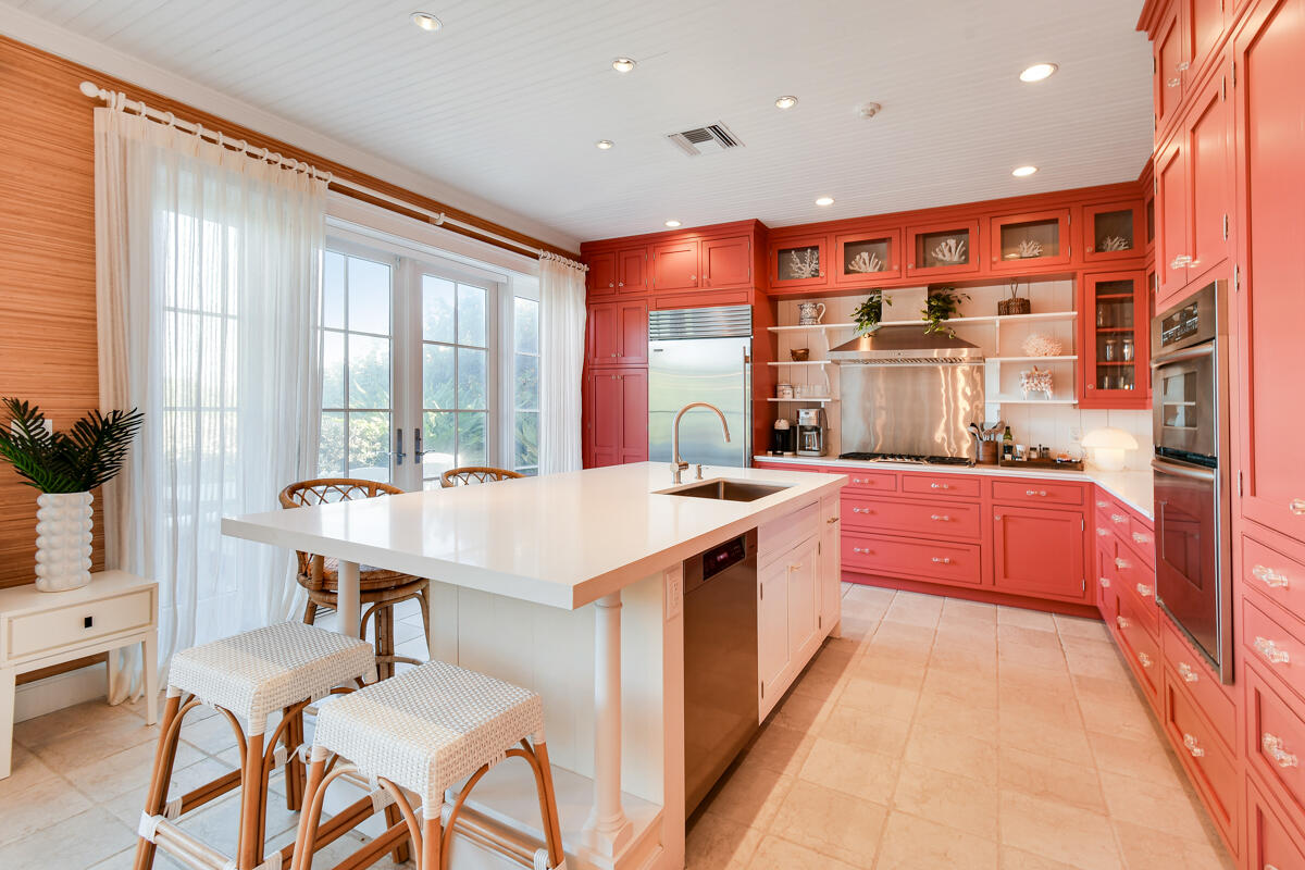 107 North Beach Road Jupiter Island, FL 33455 - Photo 25 of 49 a kitchen with stainless steel appliances granite countertop sink stove and refrigerator