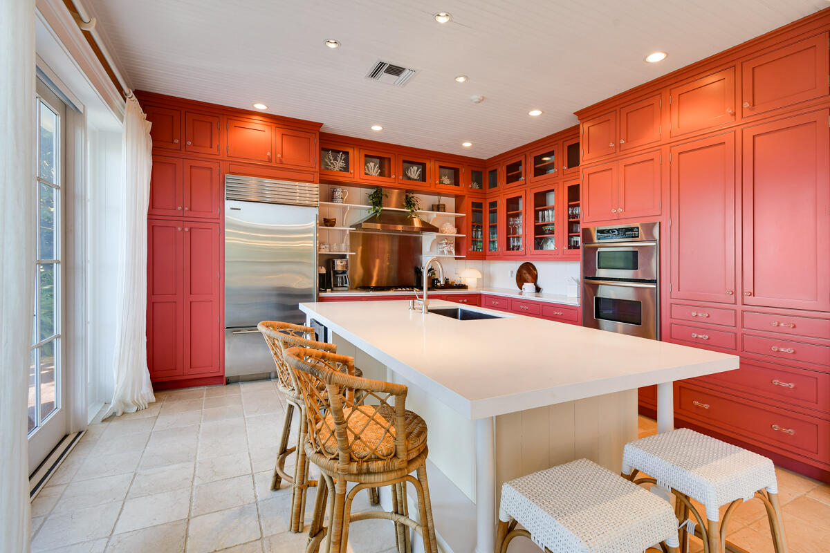 107 North Beach Road Jupiter Island, FL 33455 - Photo 26 of 49 a dining table with chairs and a table