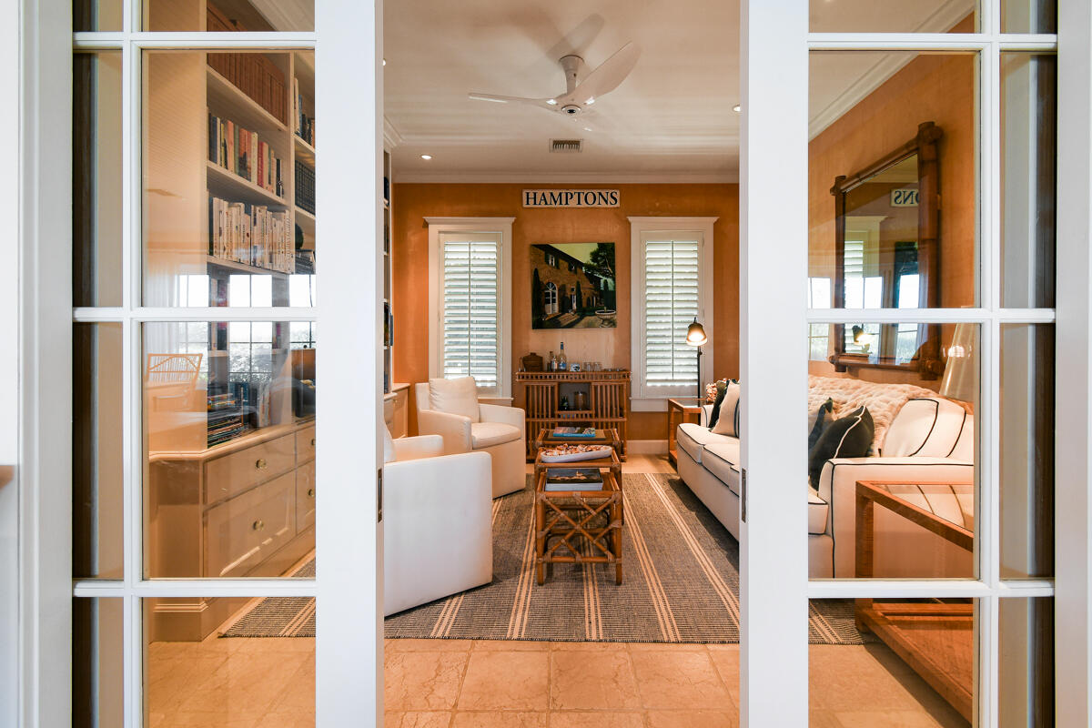 107 North Beach Road Jupiter Island, FL 33455 - Photo 29 of 49 a living room with furniture wooden floor and a large window