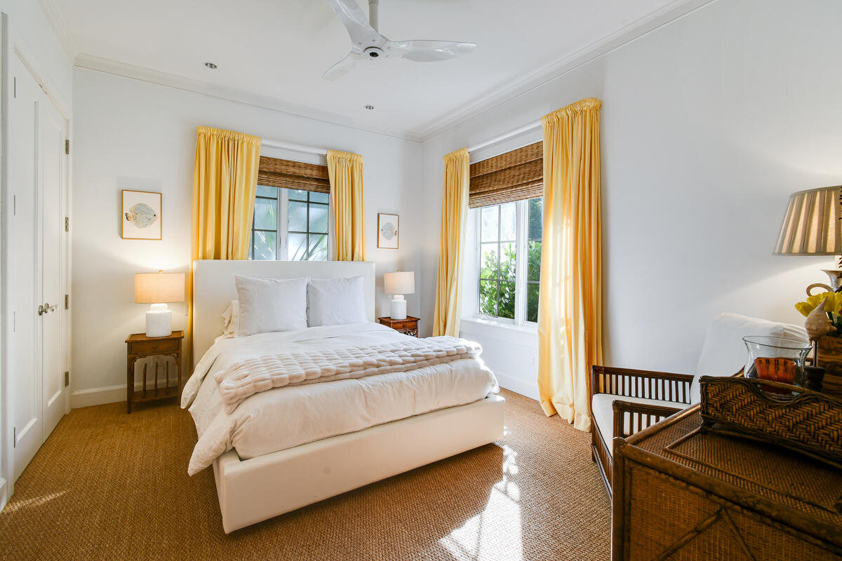 107 North Beach Road Jupiter Island, FL 33455 - Photo 32 of 49 a bedroom with a bed and wooden floor