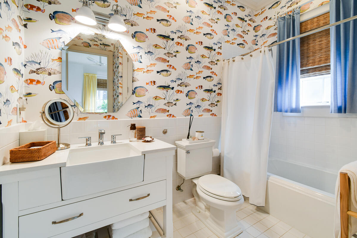 107 North Beach Road Jupiter Island, FL 33455 - Photo 34 of 49 a bathroom with a sink a toilet and a mirror