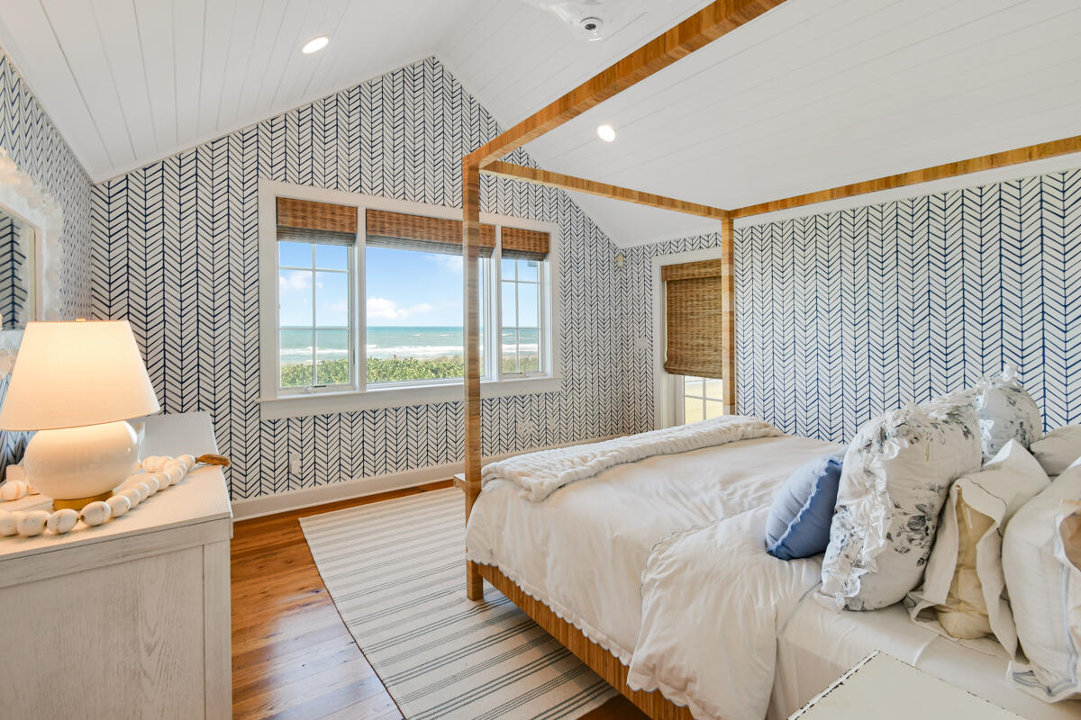 107 North Beach Road Jupiter Island, FL 33455 - Photo 38 of 49 a bedroom with bed and window