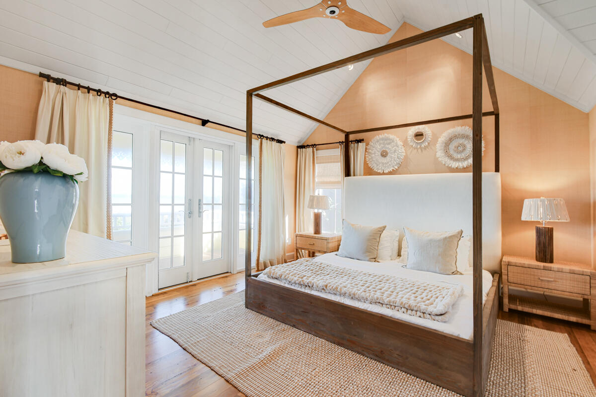 107 North Beach Road Jupiter Island, FL 33455 - Photo 43 of 49 a bedroom with a large bed and a window