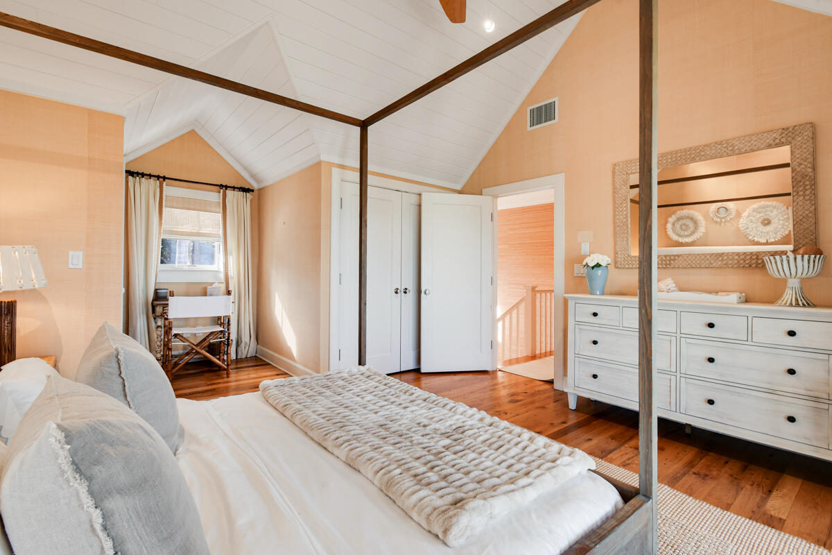 107 North Beach Road Jupiter Island, FL 33455 - Photo 45 of 49 a bedroom with a bed and a dresser