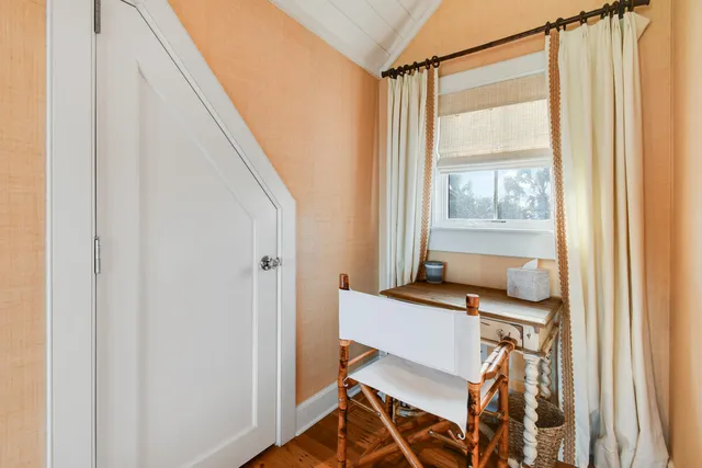 a workspace with furniture and a window