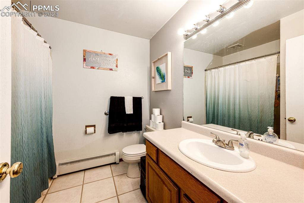 1023 Monument Street Calhan, CO 80808 - Photo 20 of 35 a bathroom with a sink and a mirror