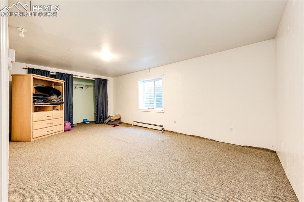 1023 Monument Street Calhan, CO 80808 - Photo 29 of 35 an empty room with windows