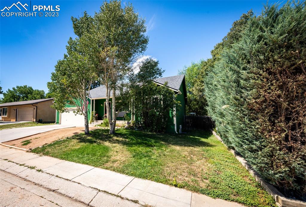 1023 Monument Street Calhan, CO 80808 - Photo 3 of 35 a view of a house with a yard
