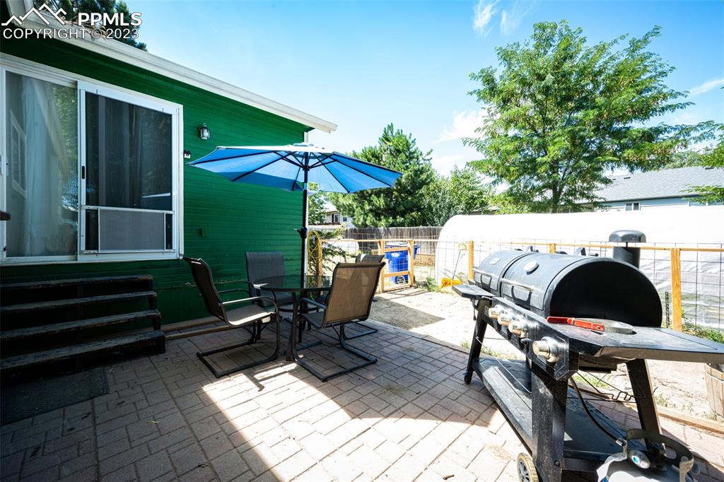 1023 Monument Street Calhan, CO 80808 - Photo 31 of 35 an outdoor sitting area with furniture and garden