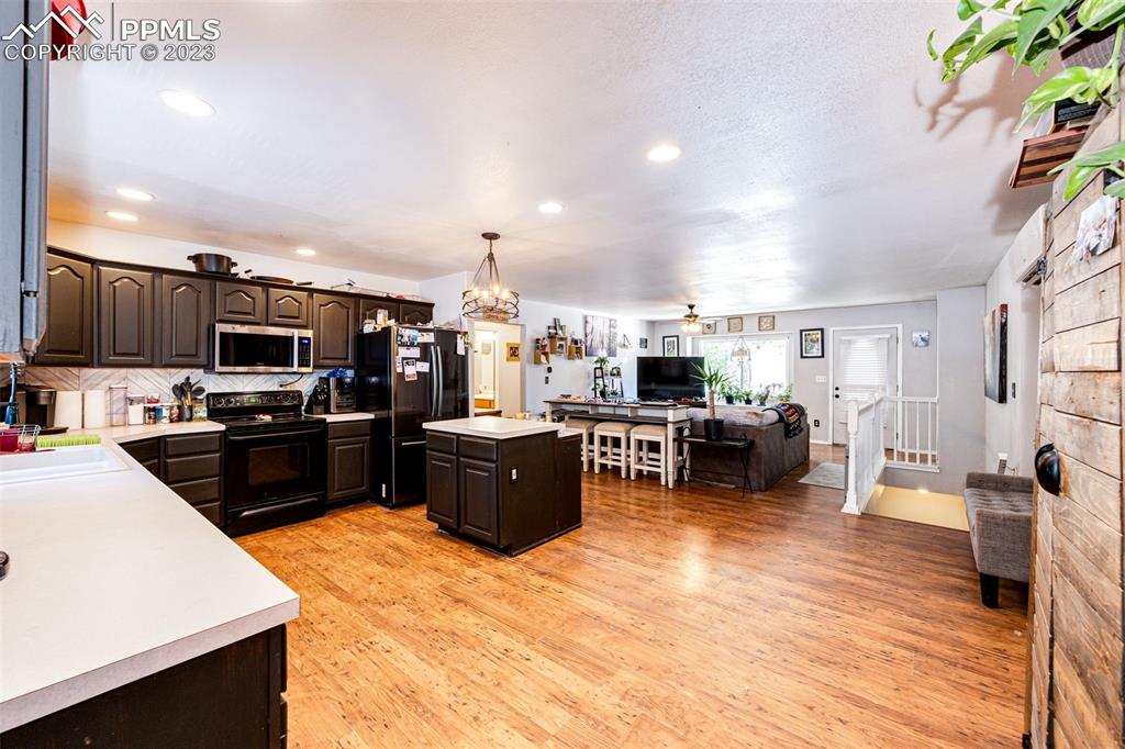 1023 Monument Street Calhan, CO 80808 - Photo 9 of 35 a kitchen with lots of counter top space and stainless steel appliances