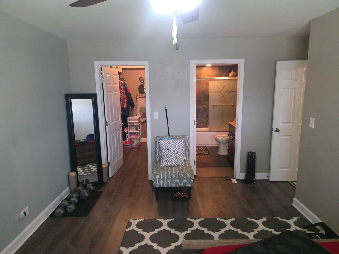 717 Tipperary Court, Unit 1C Schaumburg, IL 60193 - Photo 2 of 11 a living room with furniture and wooden floor