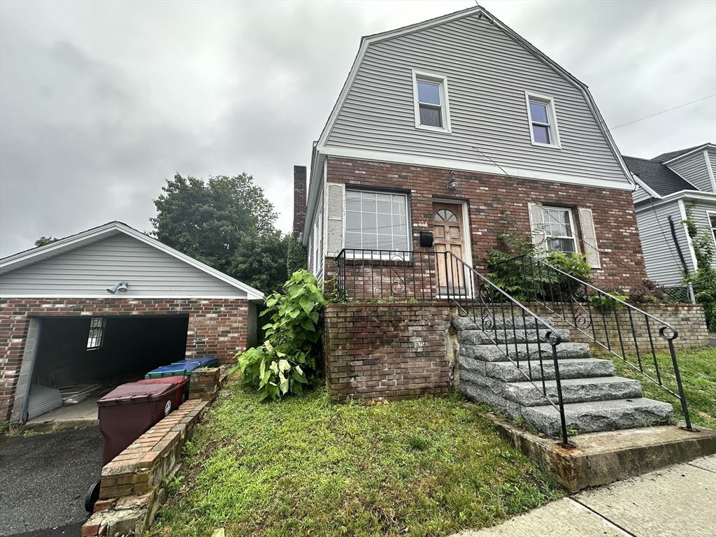 354 University Avenue Lowell, MA 01854 - Photo 2 of 13 a front view of a house with garden