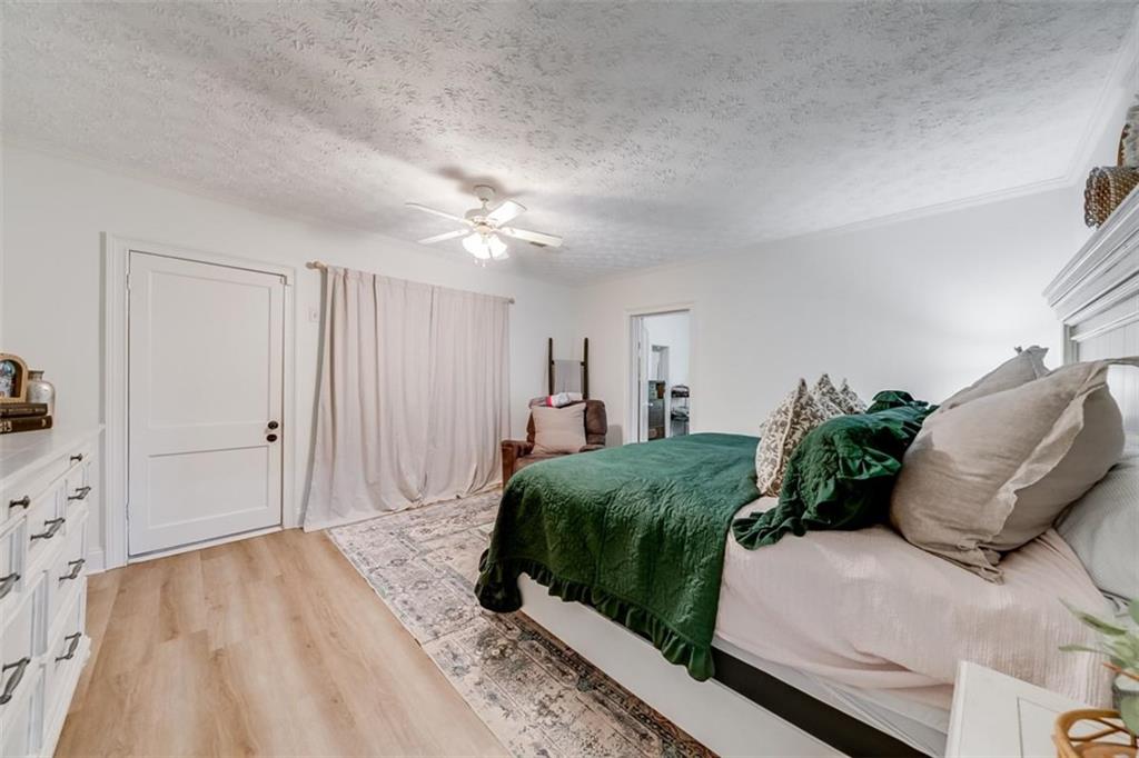 2630 Prospect Road Toccoa, GA 30577 - Photo 17 of 40 a bedroom with a bed and a couch