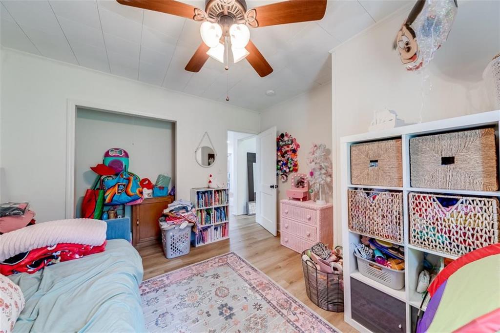 2630 Prospect Road Toccoa, GA 30577 - Photo 22 of 40 a bedroom with furniture and a chandelier fan