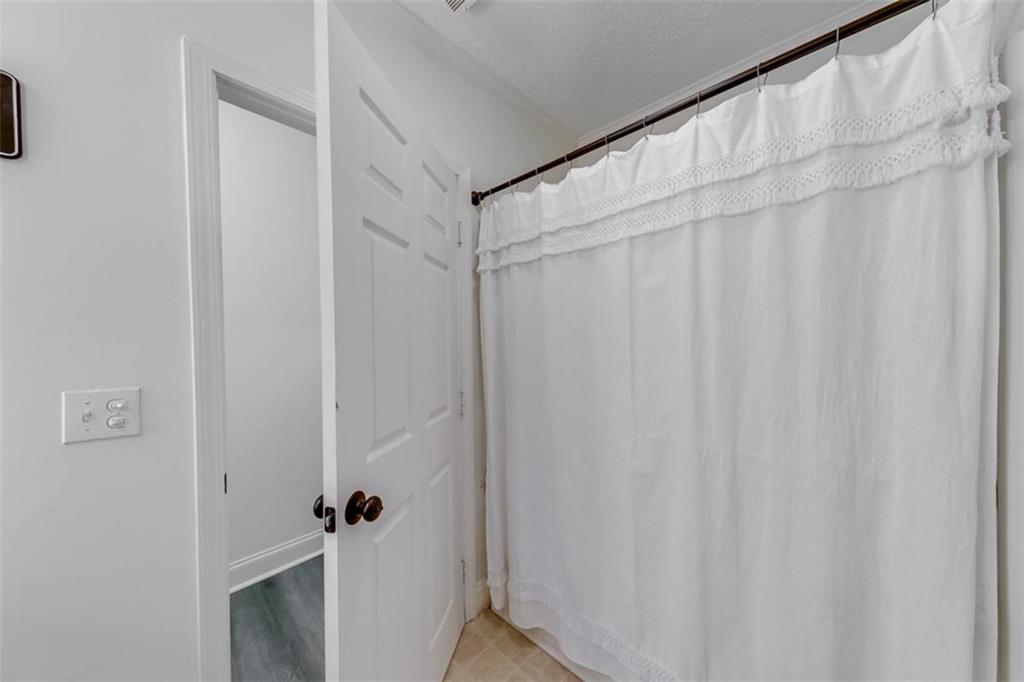 2630 Prospect Road Toccoa, GA 30577 - Photo 24 of 40 a bathroom with a shower curtain